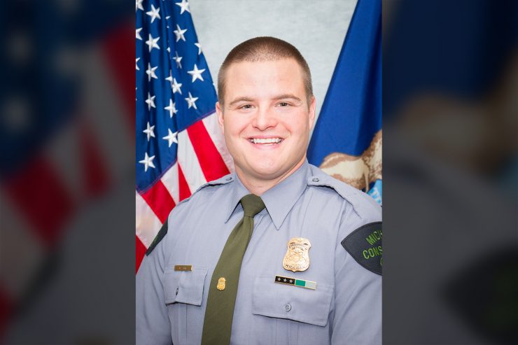 A Michigan Department of Natural Resources Conservation Officer is a hero today after risking his own life to save the life of a swimmer from a strong current.